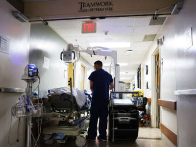 A clinician cares for a patient in the Emergency Department at Providence St. Mary Medical Center on March 11, 2022, in Apple Valley, California.