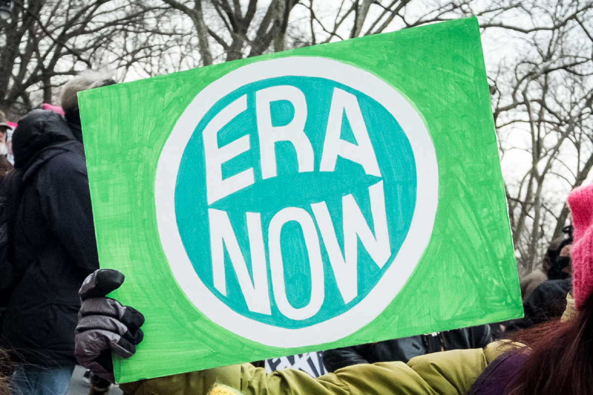 A marcher holds a sign that says ERA NOW during the Woman's March in the borough of Manhattan in New York on January 18, 2020.