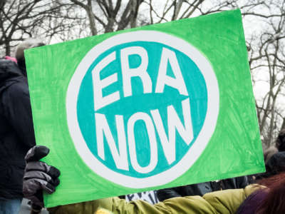 A marcher holds a sign that says ERA NOW during the Woman's March in the borough of Manhattan in New York on January 18, 2020.