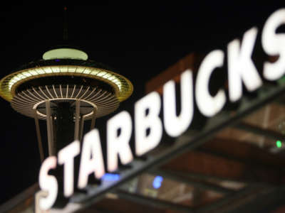 A view of the Seattle's Space Needle, in front of a Starbucks coffee sign, on September 30, 2006.