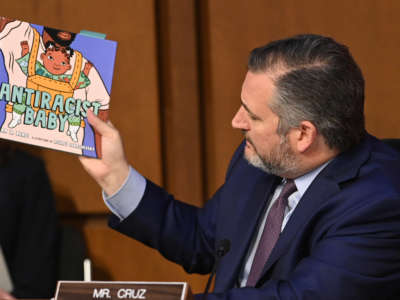 Sen. Ted Cruz holds a book titled Antiracist Baby while speaking during the confirmation hearing for Judge Ketanji Brown Jackson before the Senate Judiciary Committee on her nomination to be an Associate Justice on the Supreme Court, in the Hart Senate Office Building on Capitol Hill in Washington, D.C., on March 22, 2022.