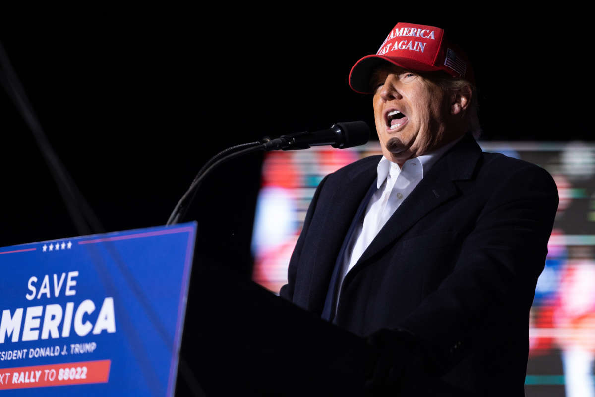 Former President Donald Trump speaks to the crowd during a rally at the Florence Regional Airport on March 12, 2022, in Florence, South Carolina.