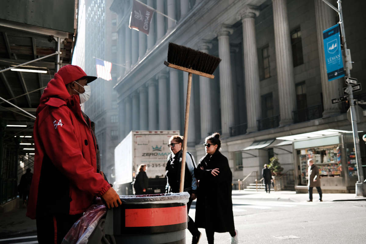 A man works on Wall Street near the New York Stock Exchange on March 11, 2022, in New York City.