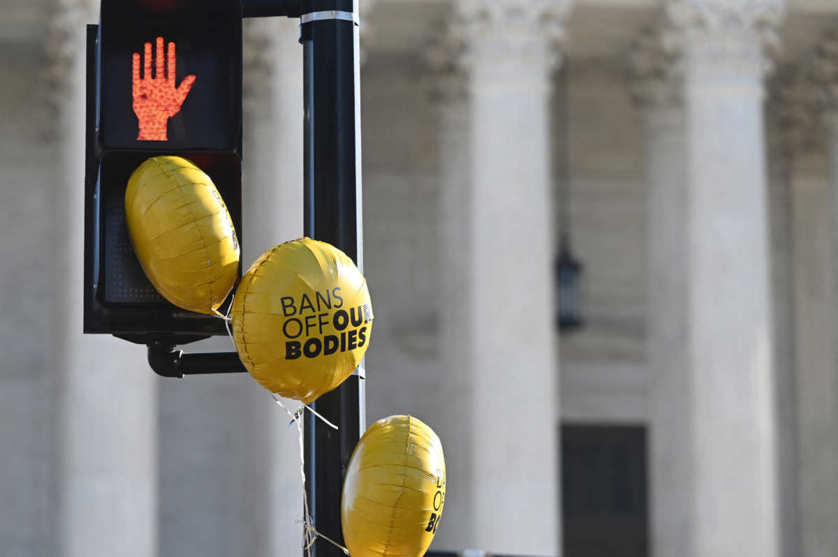 Abortion rights advocates and anti-abortion protesters demonstrate in front of the Supreme Court Building in Washington, D.C., on December 1, 2021.