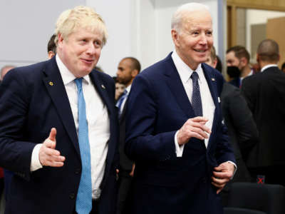 British Prime Minister Boris Johnson and U.S. President Joe Biden arrive for a G7 leaders meeting during a NATO summit at the alliance's headquarters in Brussels, on March 24, 2022, in Brussels, Belgium.