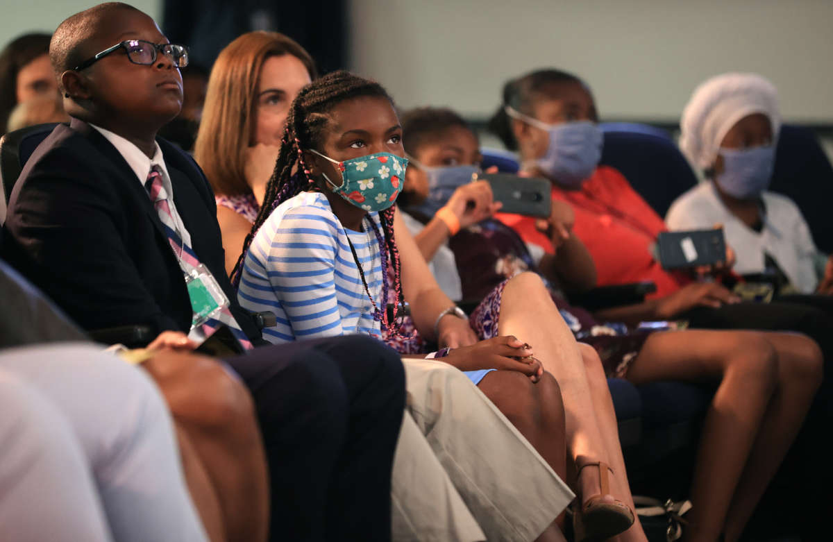 Families in the audience listen to President Joe Biden and Vice President Kamala Harris deliver remarks on the day tens of millions of parents will get their first monthly payments from the Child Tax Credit in the South Court Auditorium in the Eisenhower Executive Office Building on July 15, 2021, in Washington, D.C.