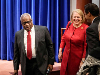 Associate Supreme Court Justice Clarence Thomas and his wife, conservative activist Virginia Thomas, arrive at the Heritage Foundation on October 21, 2021, in Washington, D.C.