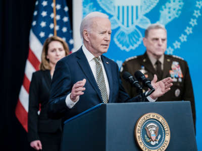 President Joe Biden delivers remarks on Ukraine, flanked by Deputy Secretary of Defense Kathleen Hicks and Chairman of the Joint Chiefs of Staff Gen. Mark Milley, from the Eisenhower Executive Office Building at the White House on March 16, 2022, in Washington, D.C.