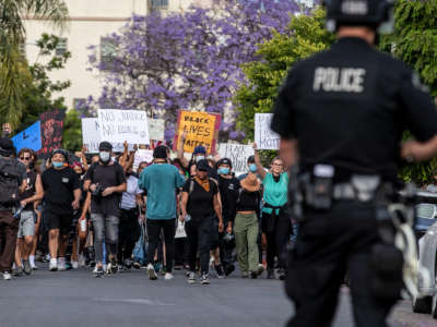 Hundreds of protestors march numerous blocks demonstrating against police brutality and the death of George Floyd on June 1, 2020, in Hollywood, California.