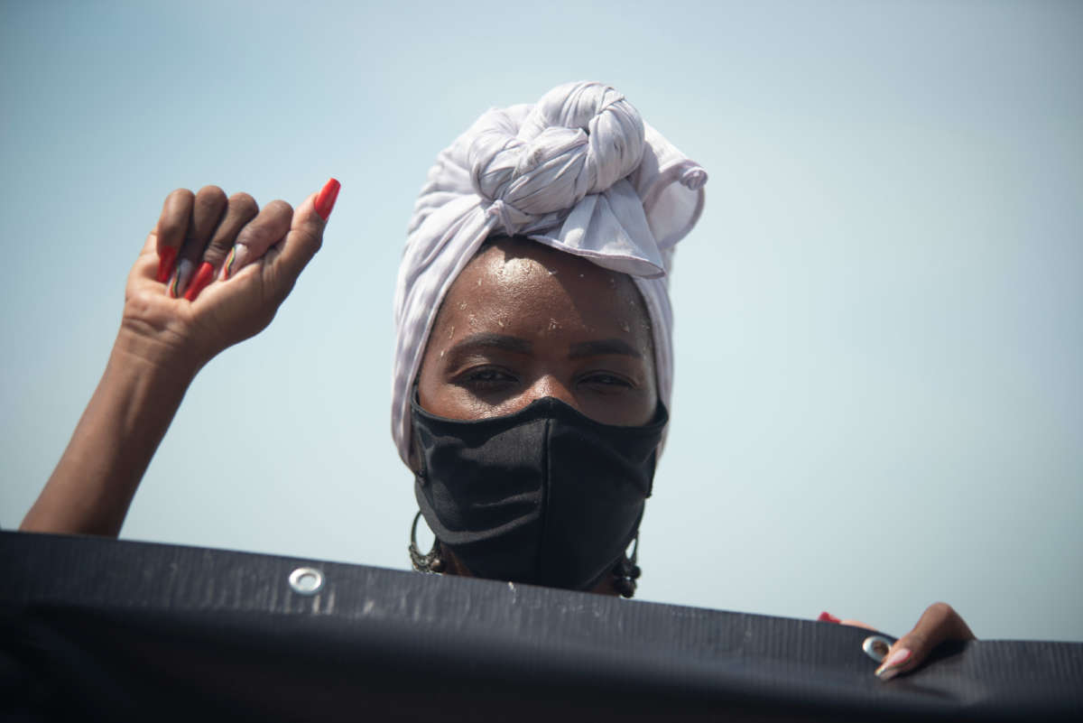 Protesters demonstrate in memory of the murder of 24-year-old Congolese Moïse Kabagambe and against violence against refugees from the Democratic Republic of Congo in Rio de Janeiro, Brazil, on February 5, 2022.