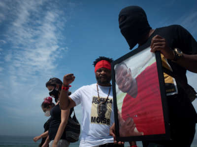 Protesters demonstrate in memory of the murder of 24-year-old Congolese Moïse Kabagambe and against violence against refugees from the Democratic Republic of Congo in Rio de Janeiro, Brazil, on February 5, 2022.