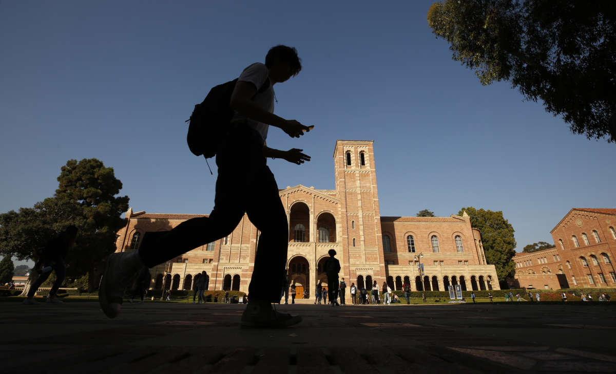 A student walks by Royce Hall on the campus of the University of California, Los Angeles (UCLA) on November 17, 2021.