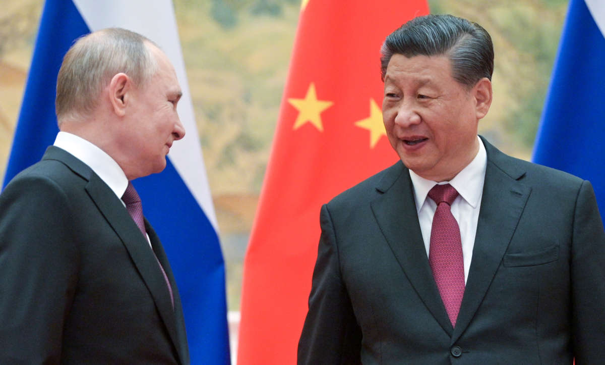 Russia's President Vladimir Putin and China's President Xi Jinping pose during a meeting at the Diaoyutai State Guesthouse in Beijing, China, on February 4, 2022.
