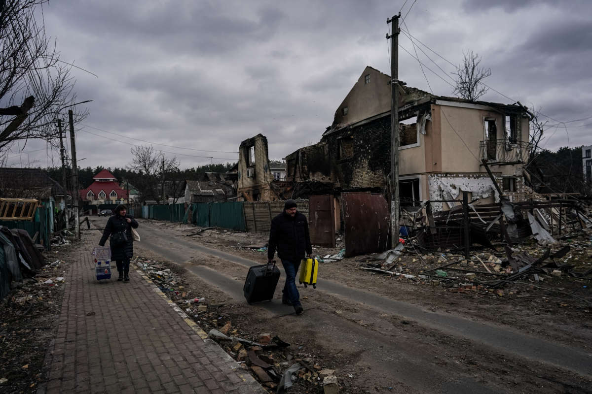 People evacuate the city of Irpin, northwest of Kyiv, on day 10 of the Russia-Ukraine war on March 5, 2022.