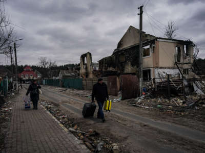 People evacuate the city of Irpin, northwest of Kyiv, on day 10 of the Russia-Ukraine war on March 5, 2022.