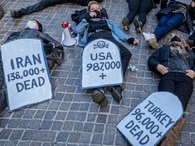 Protesters at a die-in against COVID inaction