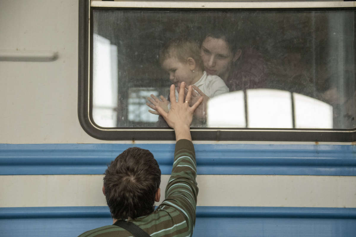 Ukrainian displaced civilians wait in the train station as they flee from the war in Lviv, Ukraine, on March 15, 2022.