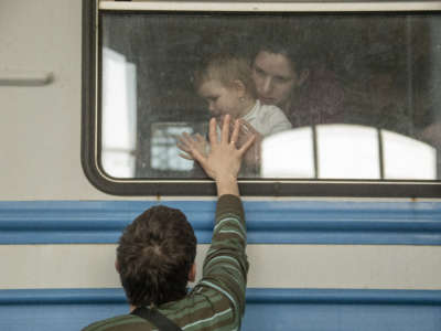 Ukrainian displaced civilians wait in the train station as they flee from the war in Lviv, Ukraine, on March 15, 2022.