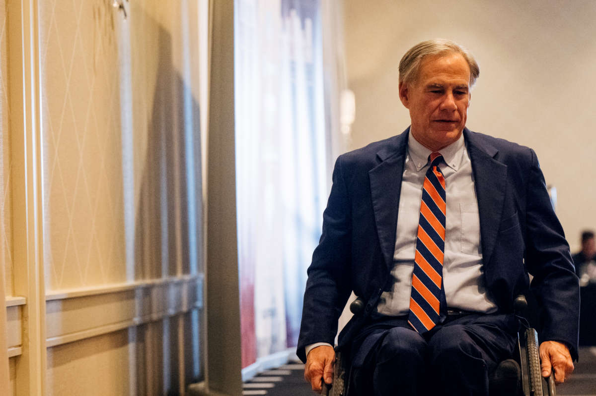 Texas Gov. Greg Abbott exits stage after speaking at the Houston Region Business Coalition's monthly meeting on October 27, 2021, in Houston, Texas.