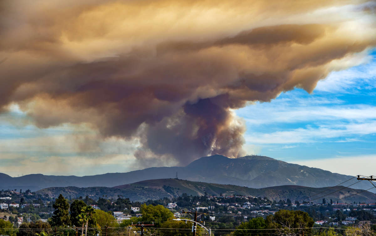 A wildfire burns in the Cleveland National Forest in this view from Orange, California, on March 2, 2022.