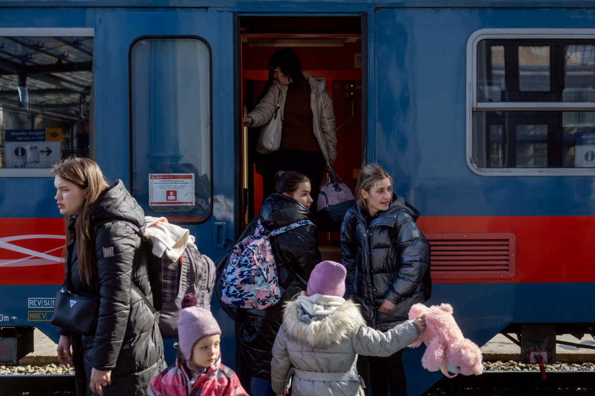 People arrive to the Western Railway Station from Zahony after crossing the border at Zahony-Csap as they flee Ukraine on March 6, 2022, in Budapest, Hungary.