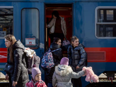 People arrive to the Western Railway Station from Zahony after crossing the border at Zahony-Csap as they flee Ukraine on March 6, 2022, in Budapest, Hungary.