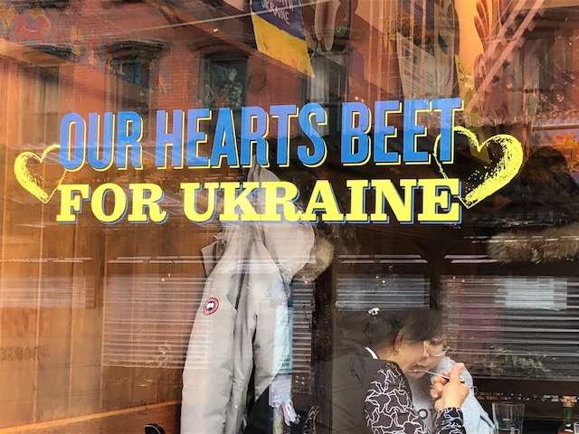 Veselka's windows are painted with messages of solidarity with the people of Ukraine.