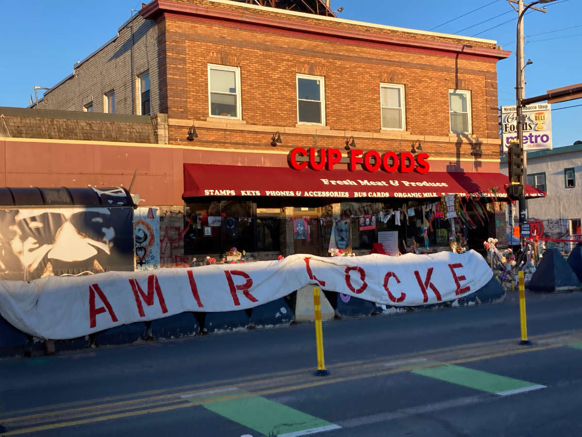 A sign honoring Amir Locke, the young Black man recently killed by police during a no knock raid in Minneapolis, Minnesota, is now part of the memorial known as “George Floyd Square.”