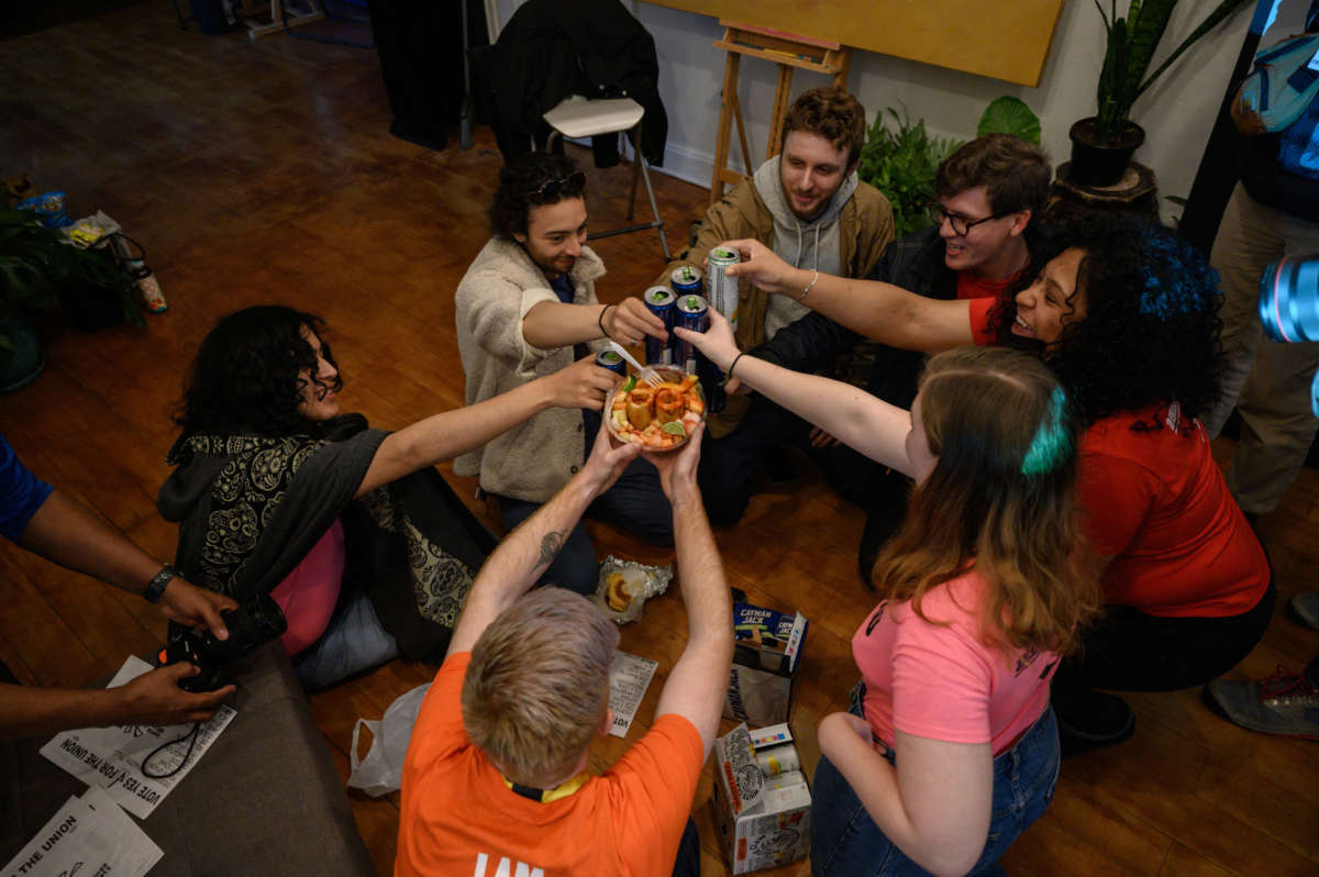 Amazon Labor Union members gather at a watch event as votes are counted, in Brooklyn, New York, on March 31, 2022.