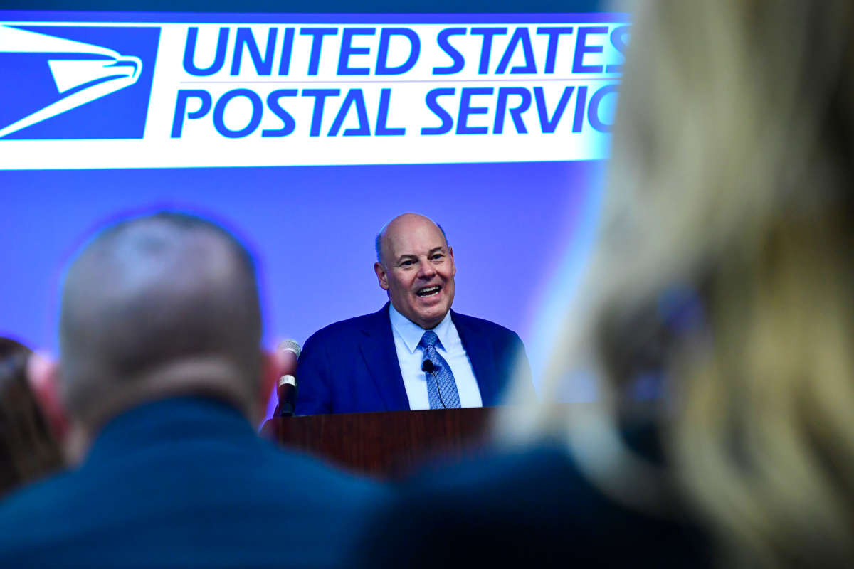 Postmaster General Louis DeJoy addresses soon to be Postmasters before they take the oath of office during a pledge ceremony at the General Mail Facility on March 16, 2022, in Denver, Colorado.