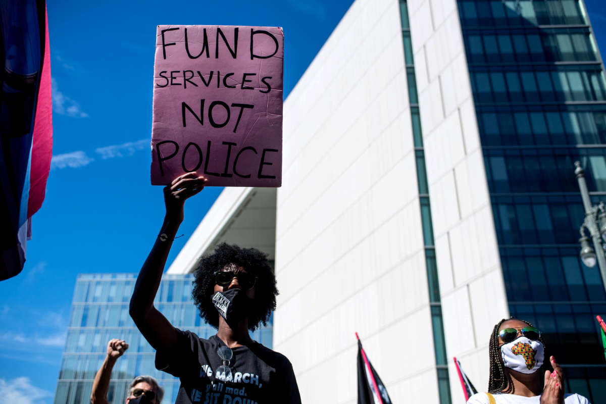 Demonstrators join a Black Lives Matter rally outside LAPD Headquarters in Los Angeles, California, during the first anniversary of George Floyd's death on May 25, 2021.