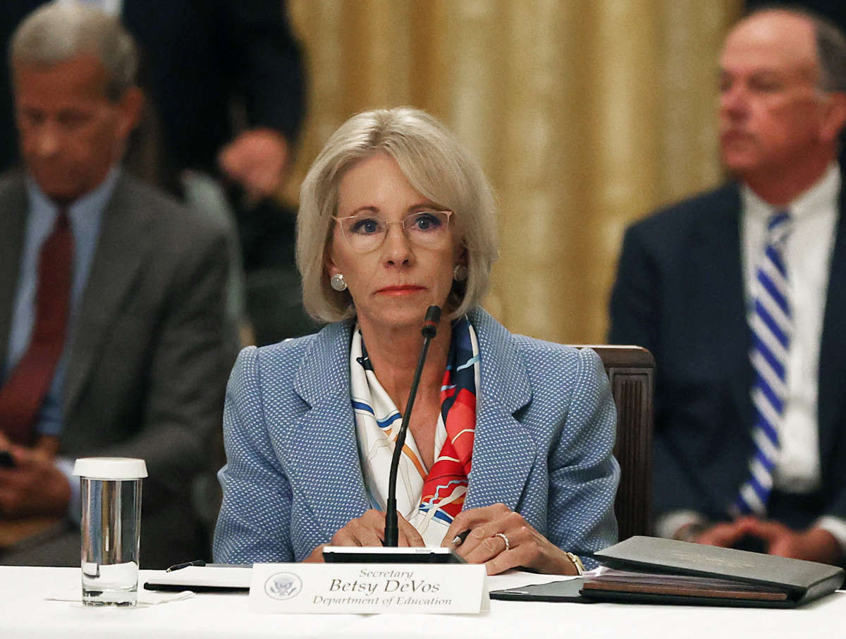 Then-Education Secretary Betsy DeVos attends an event hosted by then-President Donald Trump with students, teachers and administrators about how to safely reopen schools during the COVID-19 pandemic in the East Room at the White House July 7, 2020, in Washington, D.C.