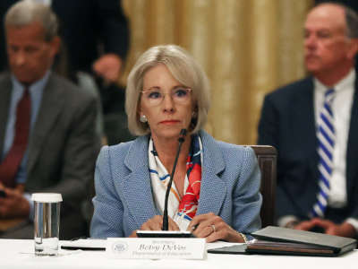 Then-Education Secretary Betsy DeVos attends an event hosted by then-President Donald Trump with students, teachers and administrators about how to safely reopen schools during the COVID-19 pandemic in the East Room at the White House July 7, 2020, in Washington, D.C.