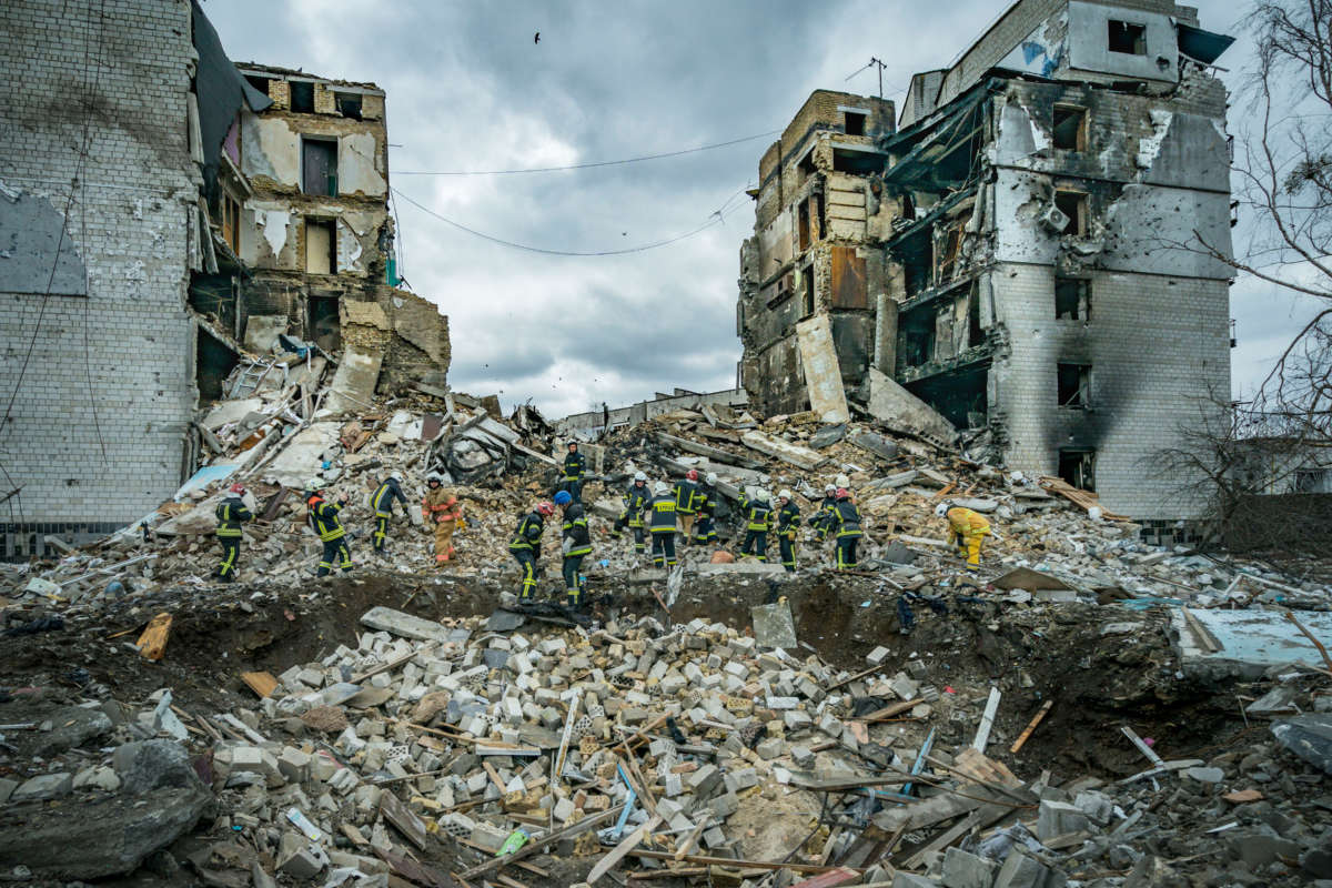 A rescue team clears debris of a destroyed building in Borodianka after combat during Russia's war in Ukraine.