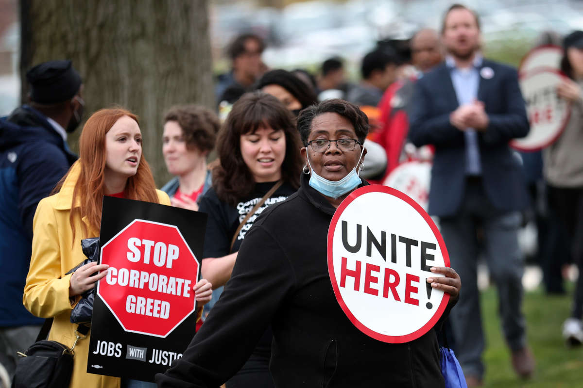Senate cafeteria workers and union members from UNITE HERE Local 23 & 25 demonstrate outside Senate office buildings on April 6, 2022, in Washington, D.C.