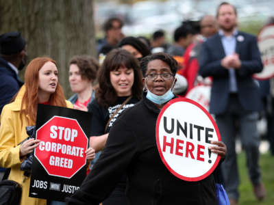 Senate cafeteria workers and union members from UNITE HERE Local 23 & 25 demonstrate outside Senate office buildings on April 6, 2022, in Washington, D.C.