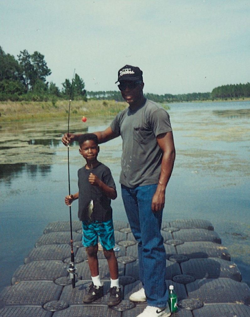 Young Javon Kennerson goes fishing with his father in 1990 at Kingsbay Naval Weapons Station in Kingsbay, Georgia.