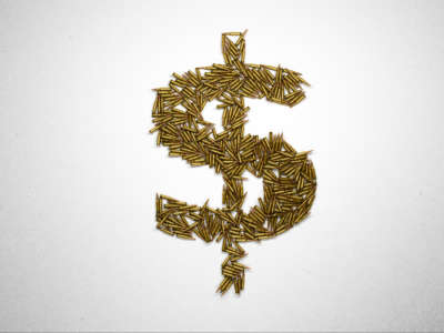 Dollar sign made of riffle bullets on white background.