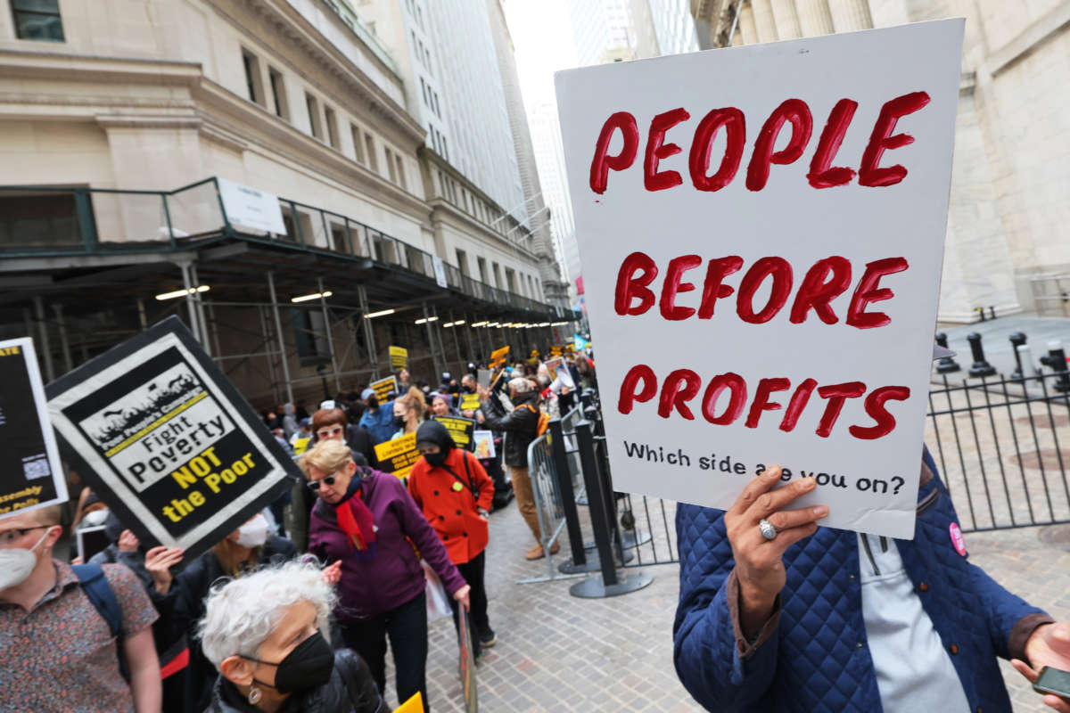 People participate in a march to Trinity Church for a moral Mass on April 11, 2022, in New York City.