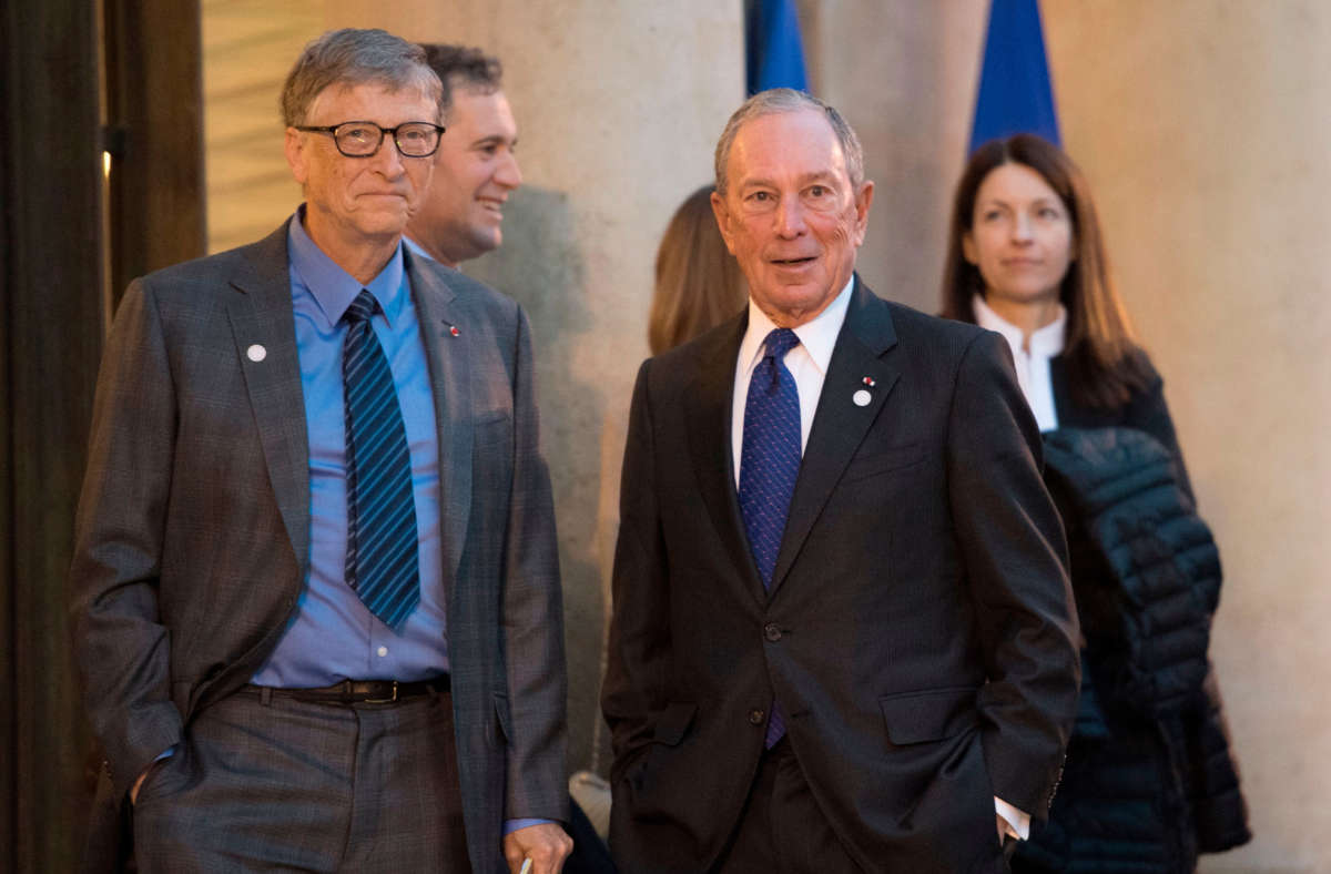 Bill Gates, left, and Michael Bloomberg arrive for a meeting with the French President on December 12, 2017, at the Elysee palace in Paris.