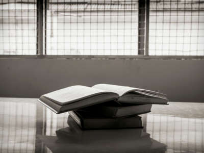 Pile of books on a table in prison