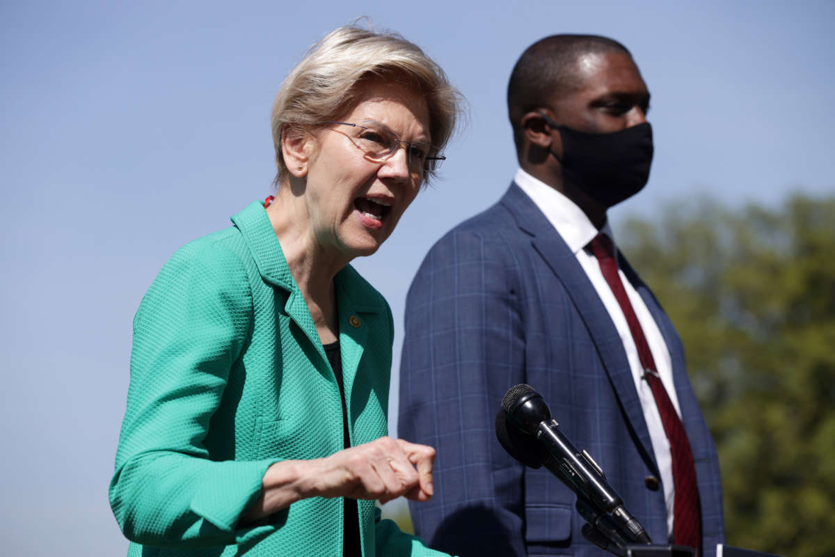 Sen. Elizabeth Warren speaks as Rep. Mondaire Jones listens during a news conference outside the U.S. Capitol on April 27, 2021, in Washington, D.C.