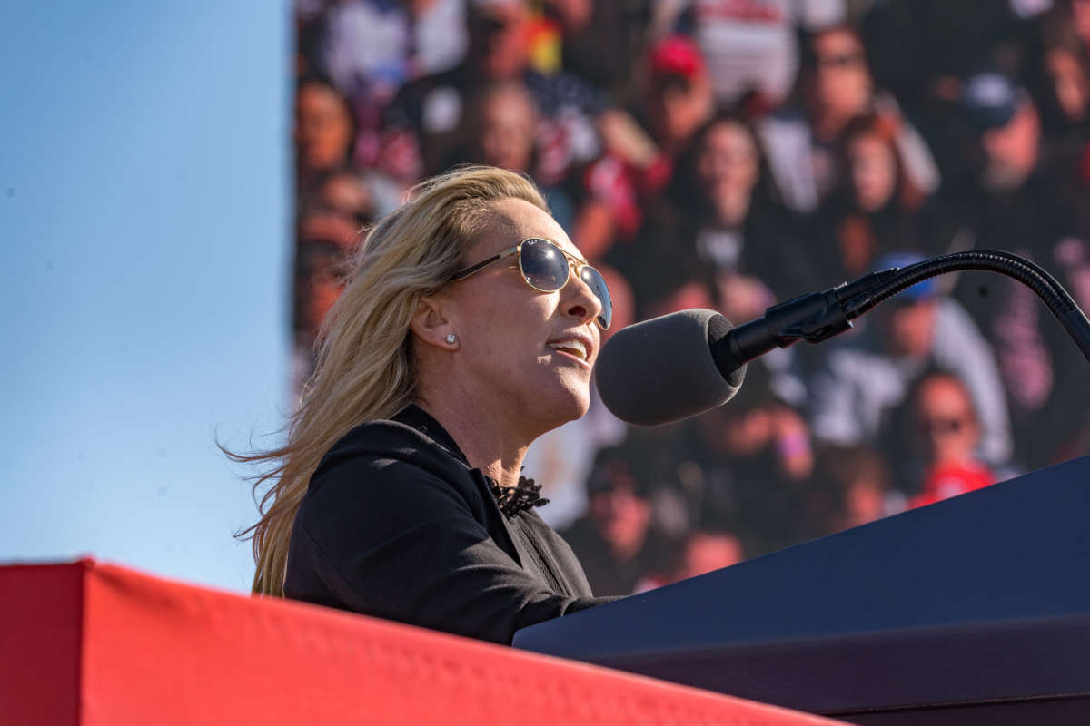 Rep. Marjorie Taylor Greene speaks to supporters of former President Donald Trump at the Banks County Dragway on March 26, 2022, in Commerce, Georgia.