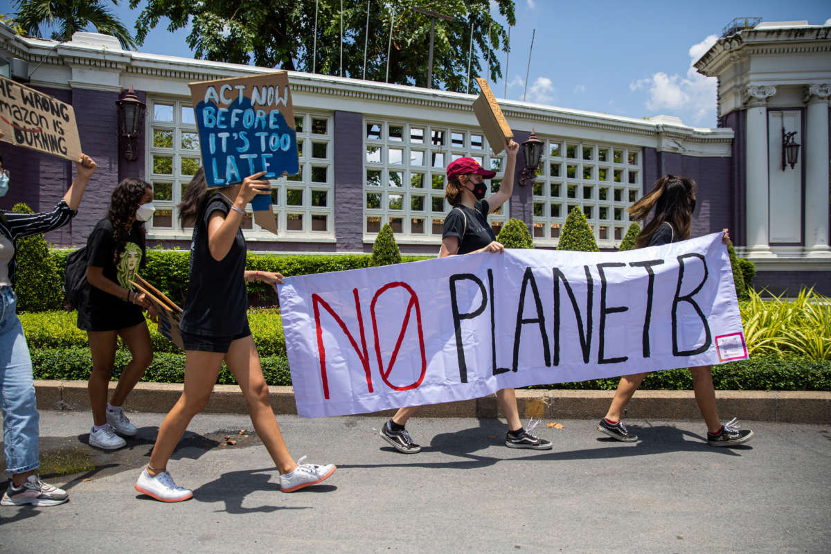 Environmental activists hold a sign that says 'no planet B' during an Earth Day rally on April 22, 2022, in Bangkok, Thailand.