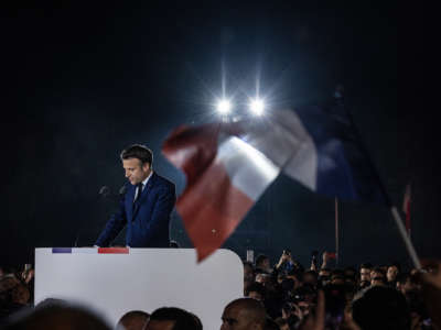 Emmanuel Macron speaks to a crowd of supporters