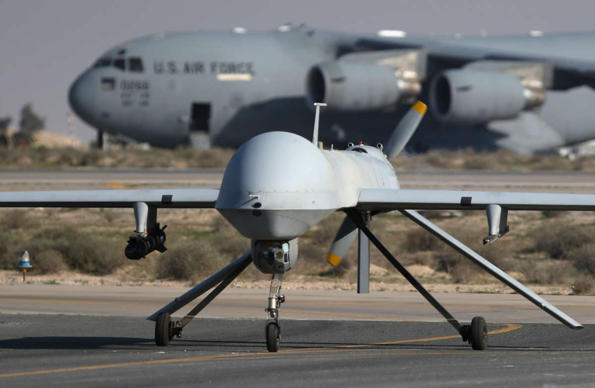 A U.S. Air Force MQ-1B Predator unmanned aerial vehicle lands at a secret air base in the Persian Gulf region on January 7, 2016.