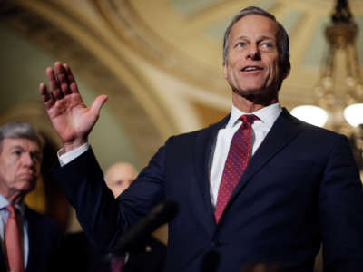 Sen. John Thune talks to reporters with Sen. Roy Blunt, left, following the weekly Senate Republican policy luncheon at the U.S. Capitol on March 29, 2022, in Washington, D.C.