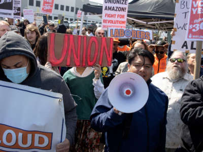 Supporters of Amazon workers attempting to win a second union election at the LDJ5 Amazon Sort Center rally on April 24, 2022, in Staten Island, New York.