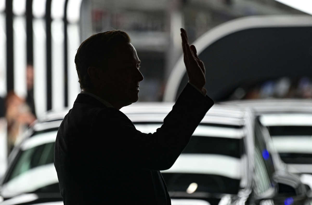 Tesla CEO Elon Musk waves as he attends the start of the production at Tesla's Gigafactory on March 22, 2022, in Gruenheide, southeast of Berlin.