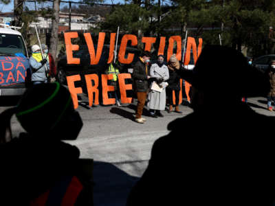 Protesters held signs as three Malden tenant association rally to demand a stop to evictions in their buildings, safer conditions, and space for negotiations with Carabetta Management and The Mystic Valley Charter School in Malden, Massachussetts, on March 13, 2022.